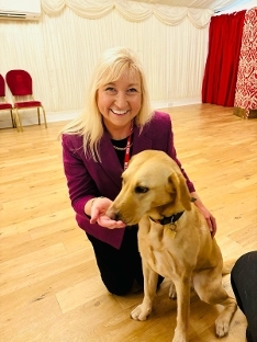 Cllr Dorrian with a guide dog